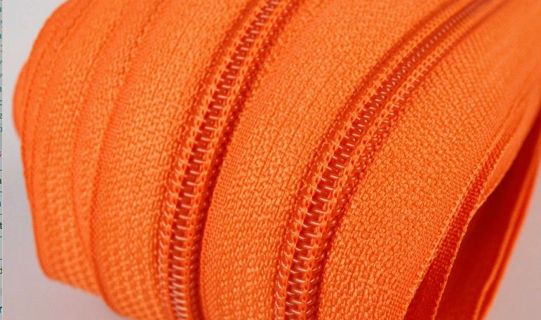 Metrážový zip spirálový 3mm oranžový 158